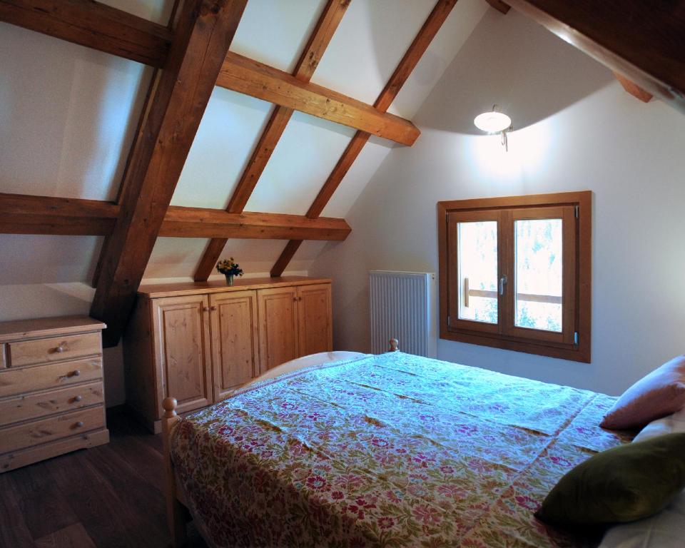 En eller flere senger på et rom på Albergo Diffuso Ravascletto