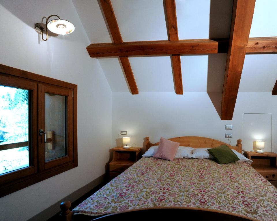 En eller flere senger på et rom på Albergo Diffuso Ravascletto