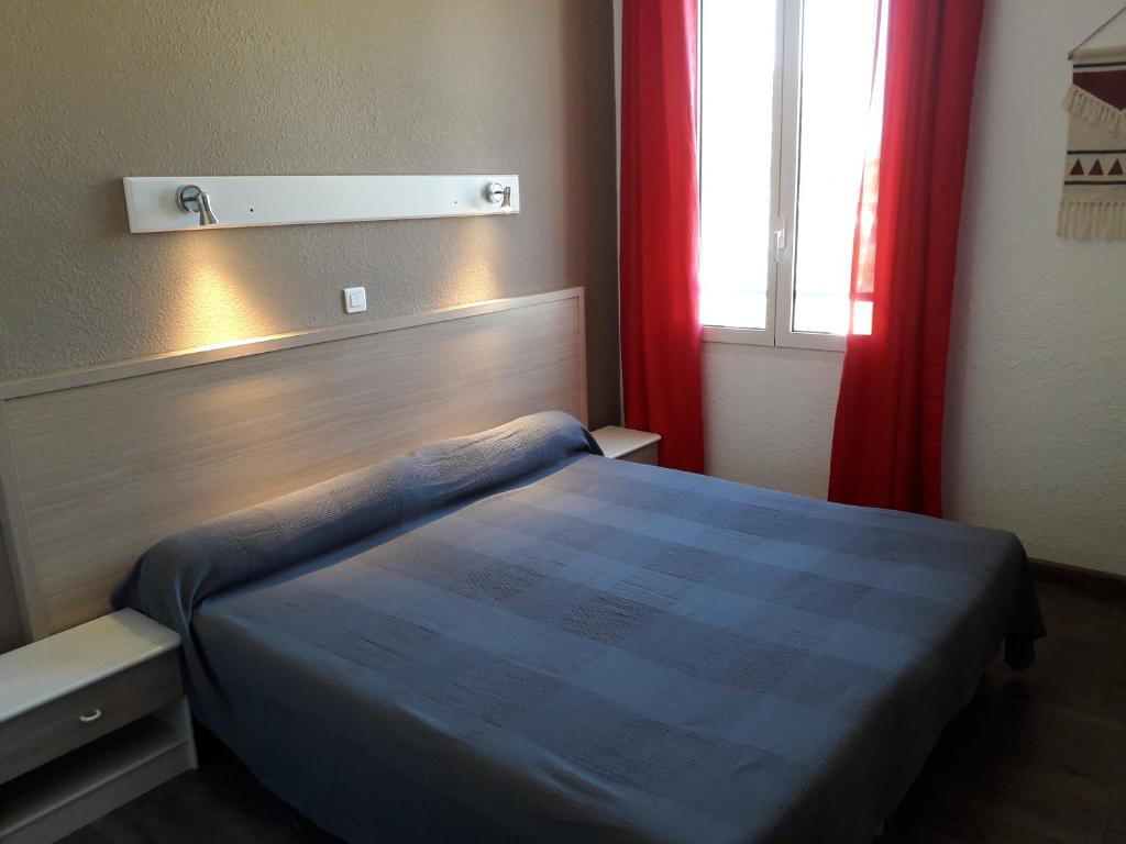 Postel nebo postele na pokoji v ubytování Hotel Le Terminus