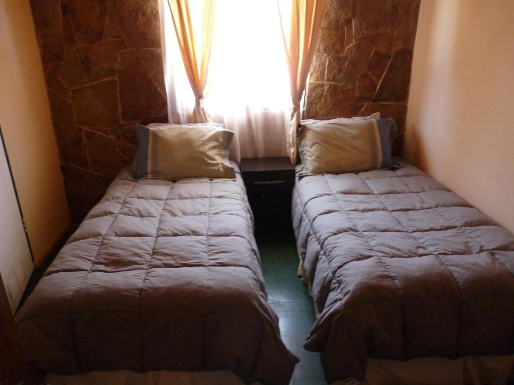 Postel nebo postele na pokoji v ubytování Hostal Desert