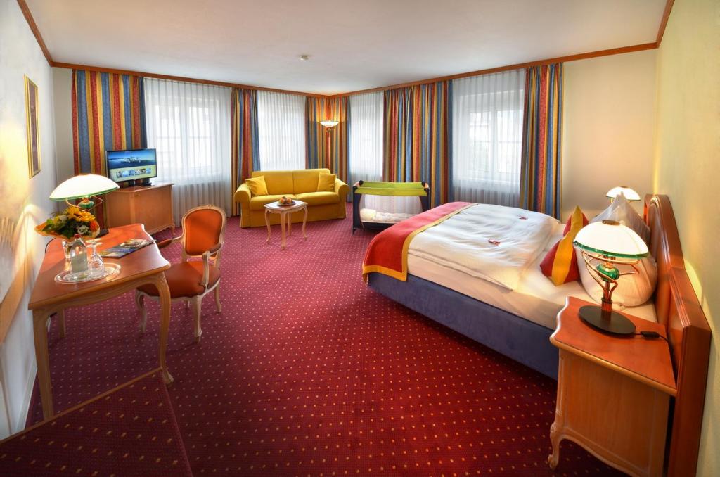Postel nebo postele na pokoji v ubytování Luitpoldpark-Hotel