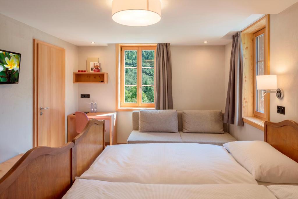 Postel nebo postele na pokoji v ubytování Hotel Nest- und Bietschhorn