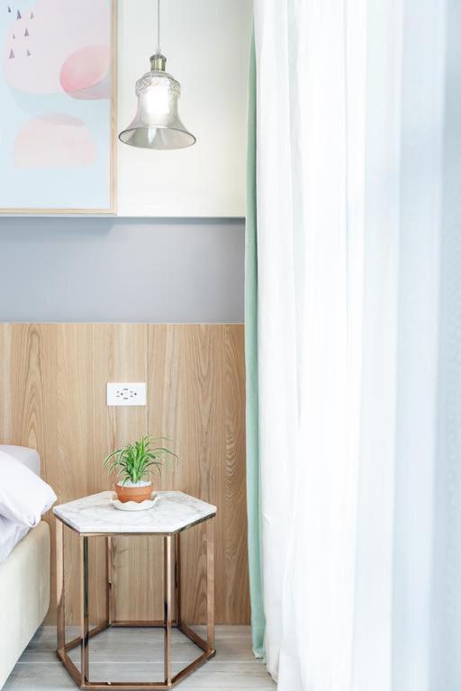 Postel nebo postele na pokoji v ubytování Kiwi Villa