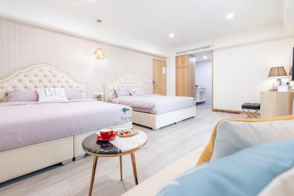 Postel nebo postele na pokoji v ubytování Kiwi Villa