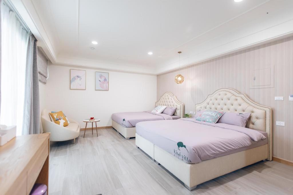Postel nebo postele na pokoji v ubytování Kiwi Villa