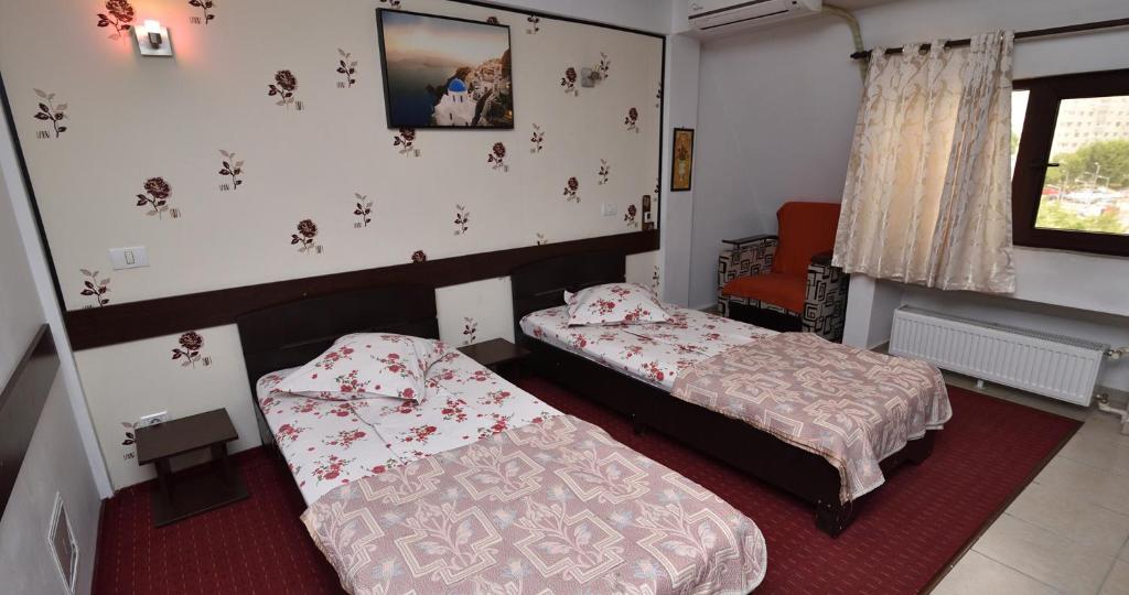 Postel nebo postele na pokoji v ubytování Hotel Taco