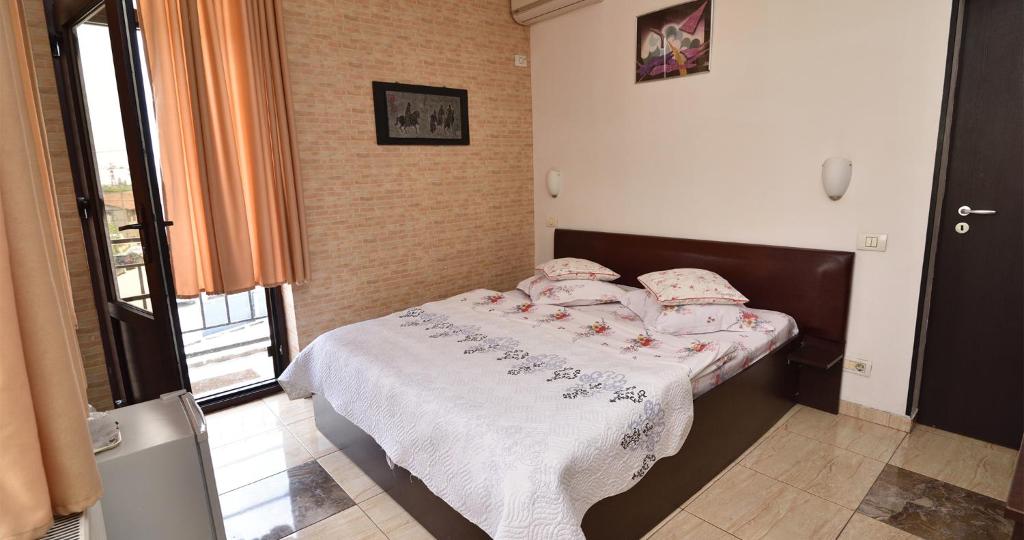 Postel nebo postele na pokoji v ubytování Hotel Taco