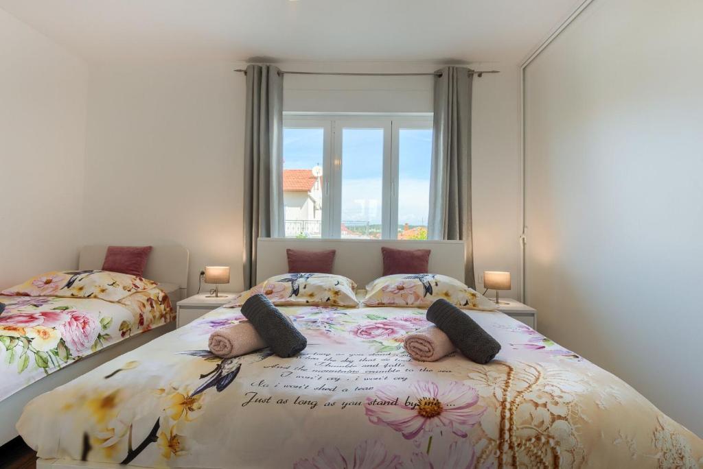 Postel nebo postele na pokoji v ubytování Esther Apartment