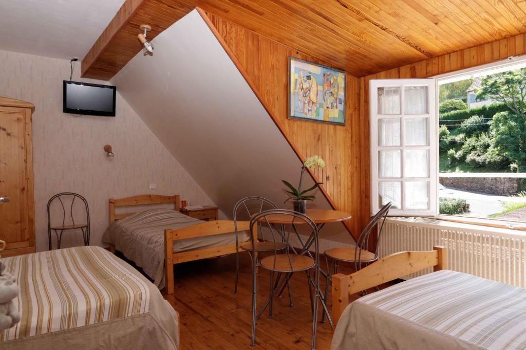 Postel nebo postele na pokoji v ubytování Chambres d'hotes à Autun