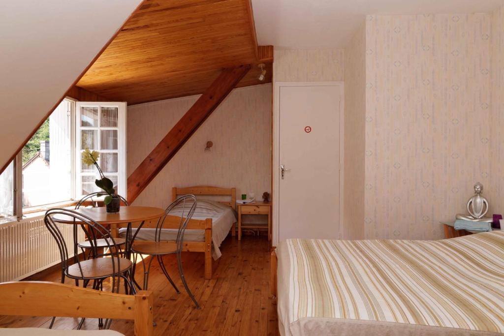 Postel nebo postele na pokoji v ubytování Chambres d'hotes à Autun