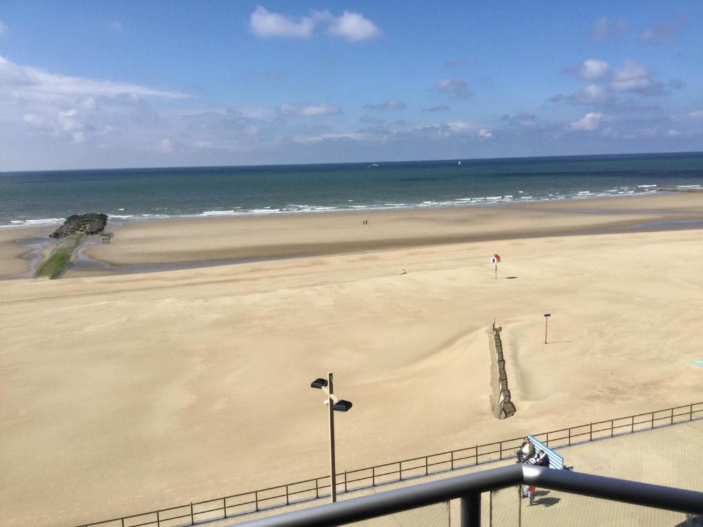 a view of a beach with a person in the sand at Melanie in Middelkerke