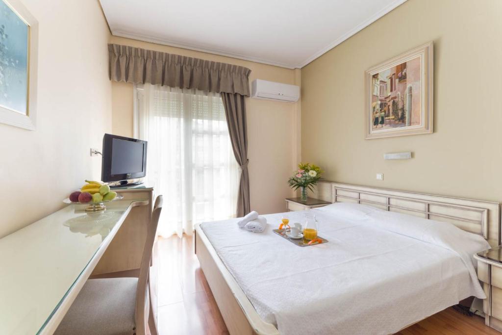 Postel nebo postele na pokoji v ubytování Lido Hotel