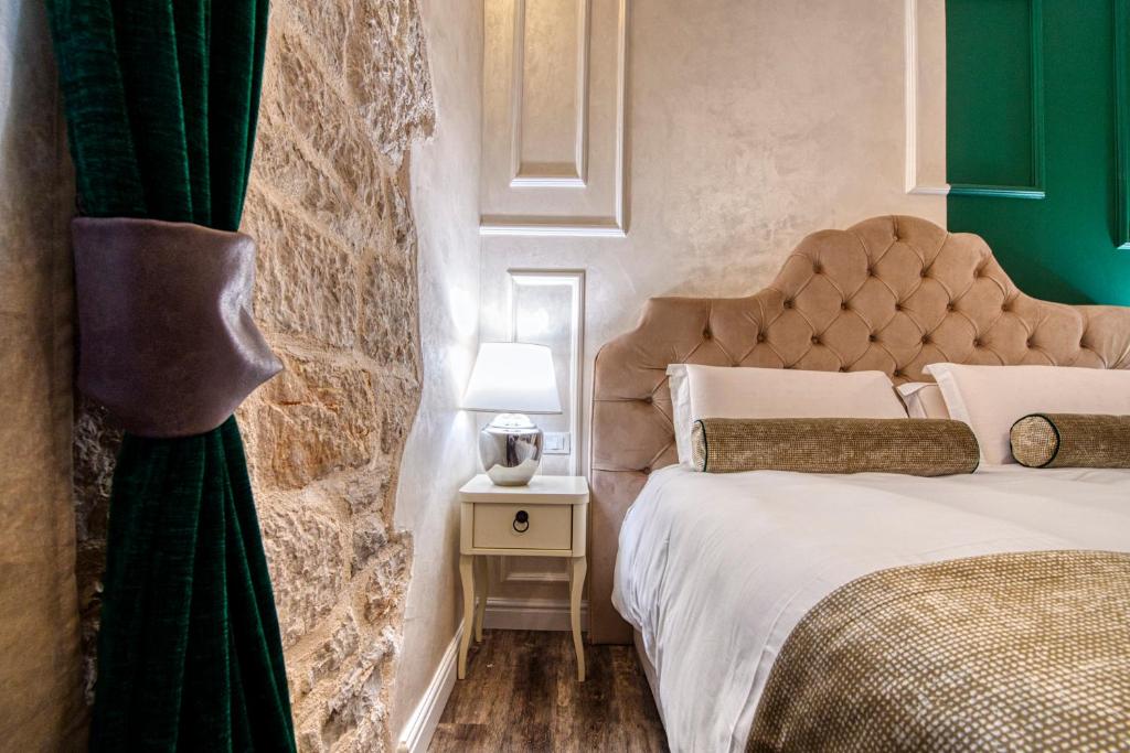 Posteľ alebo postele v izbe v ubytovaní Riva Palace - design rooms