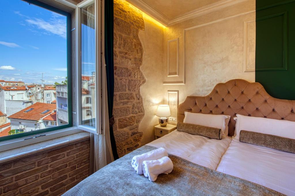 Posteľ alebo postele v izbe v ubytovaní Riva Palace - design rooms