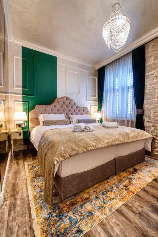 Posteľ alebo postele v izbe v ubytovaní Riva Palace - design rooms