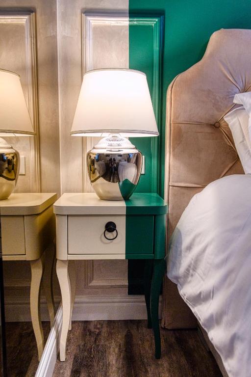 Posteľ alebo postele v izbe v ubytovaní Riva Palace - design rooms