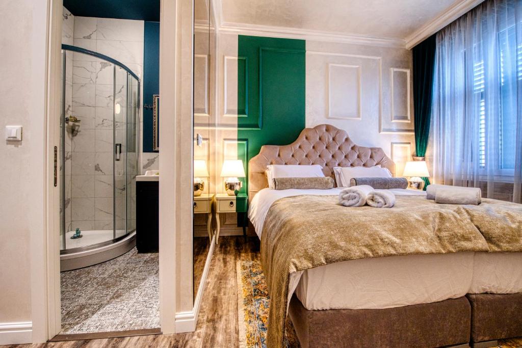 Posteľ alebo postele v izbe v ubytovaní Riva Palace - design rooms