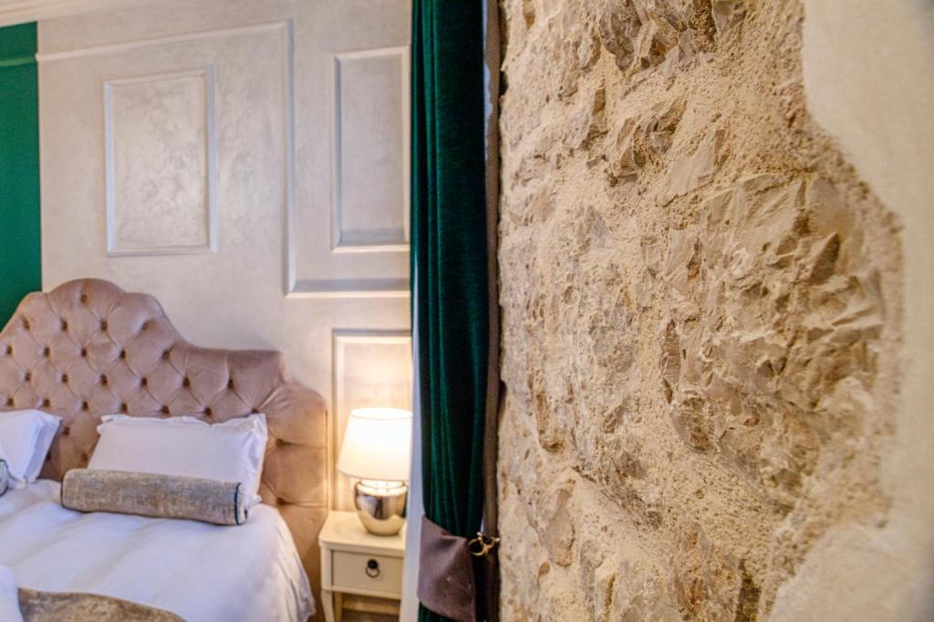 Posteľ alebo postele v izbe v ubytovaní Riva Palace - design rooms