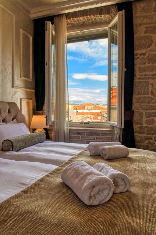 Posteľ alebo postele v izbe v ubytovaní Riva Palace - design rooms