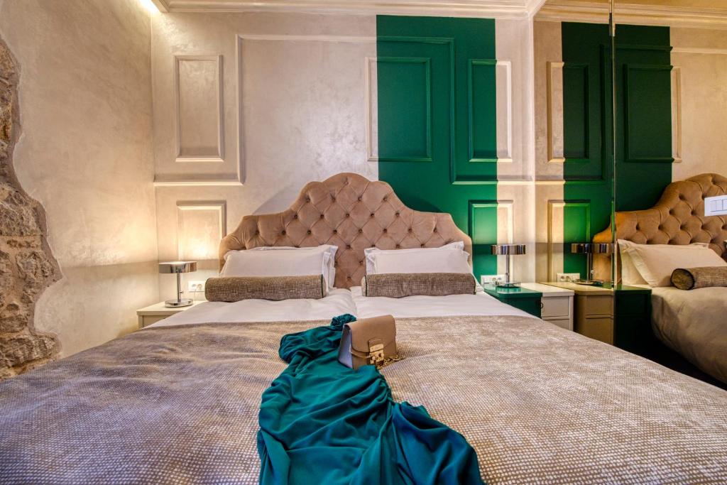 Posteľ alebo postele v izbe v ubytovaní Riva Palace - design rooms