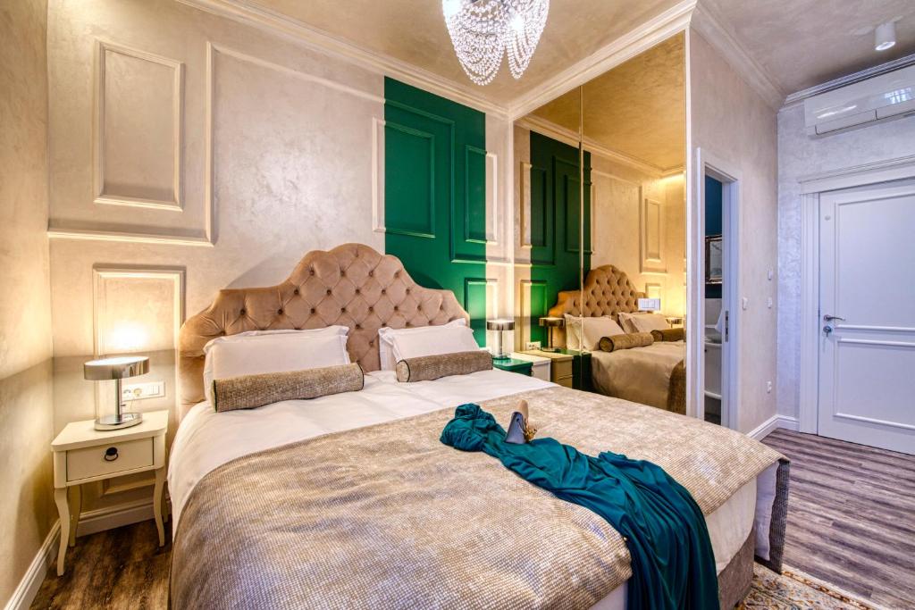 Posteľ alebo postele v izbe v ubytovaní Riva Palace - design rooms