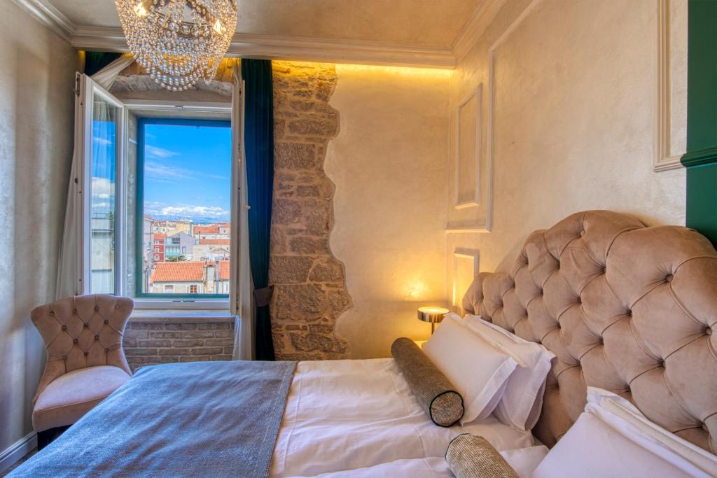 Posteľ alebo postele v izbe v ubytovaní Riva Palace - design rooms