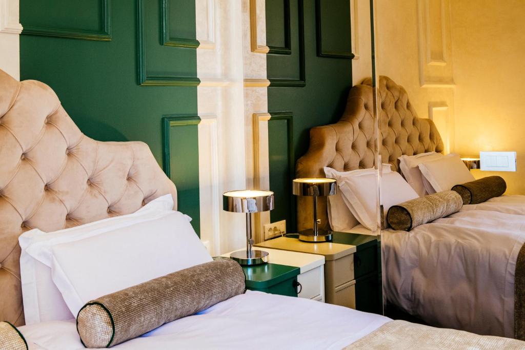 Posteľ alebo postele v izbe v ubytovaní Riva Palace - design rooms