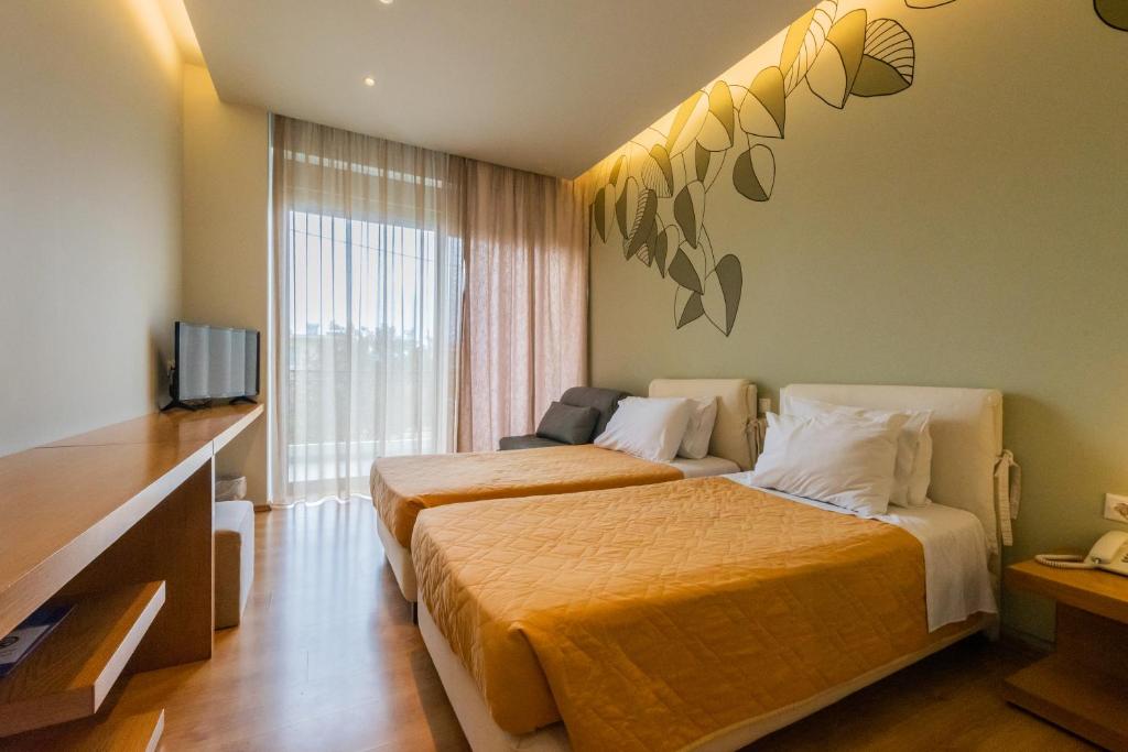 Postel nebo postele na pokoji v ubytování Kleopatra Inn