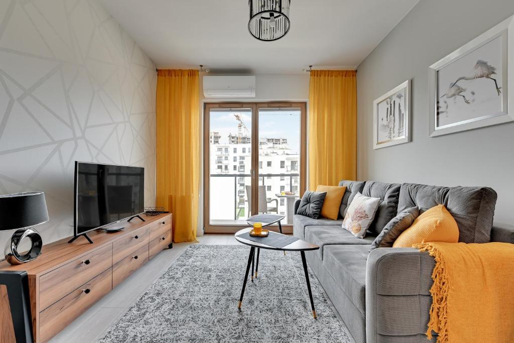 Televízia a/alebo spoločenská miestnosť v ubytovaní Luxury Voyage Apartments + extra bikes