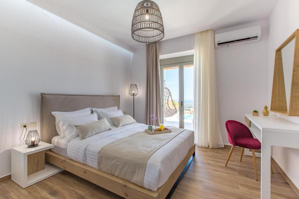 Posteľ alebo postele v izbe v ubytovaní Kallixeni Villas