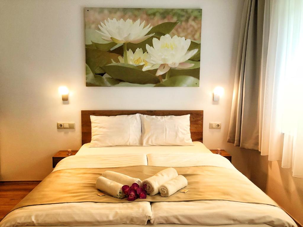 Postel nebo postele na pokoji v ubytování Boró Apartman