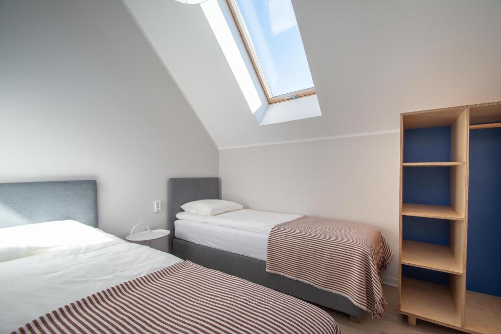 Postel nebo postele na pokoji v ubytování Domy Apartamentowe - Na Makowej