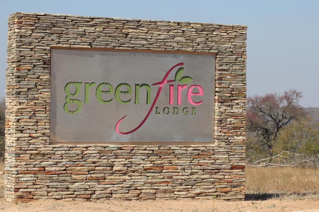 a sign on the side of a brick building at Greenfire Game Lodge in Balule Game Reserve
