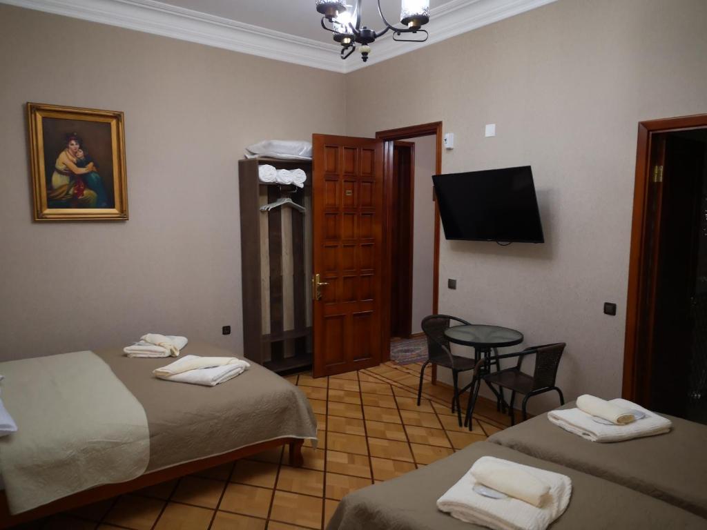 Postel nebo postele na pokoji v ubytování Hotel Villa