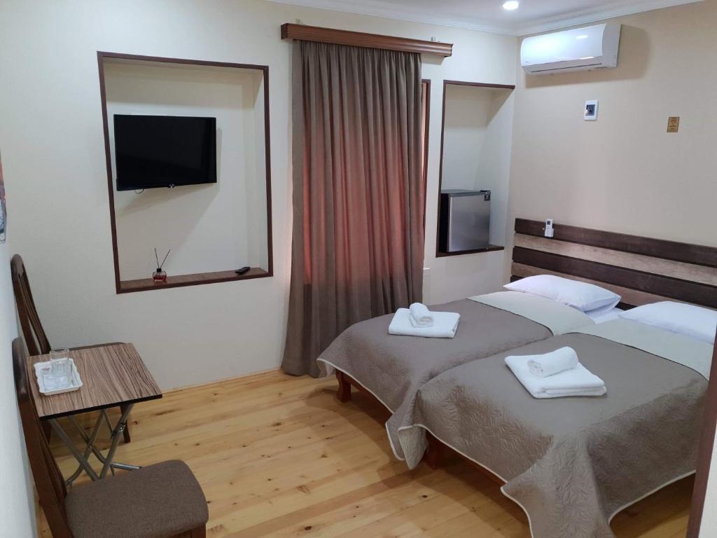 Postel nebo postele na pokoji v ubytování Hotel Villa
