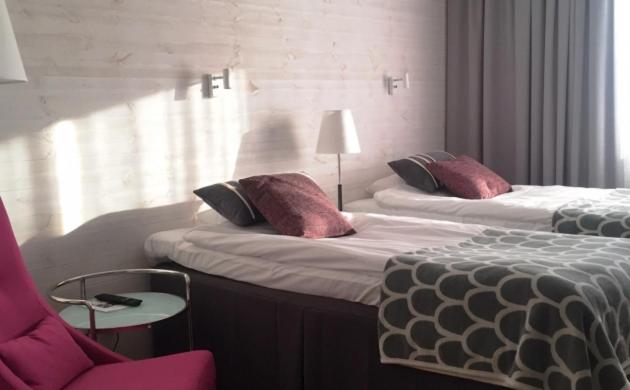 Postel nebo postele na pokoji v ubytování Yxnerum Hotell