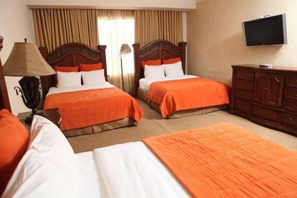 מיטה או מיטות בחדר ב-Hotel Gran Mediterraneo