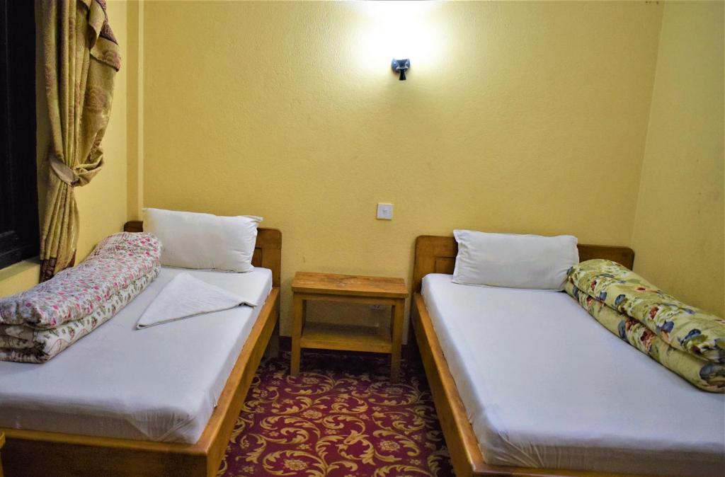 Postel nebo postele na pokoji v ubytování Berg House Cafe and Hotel