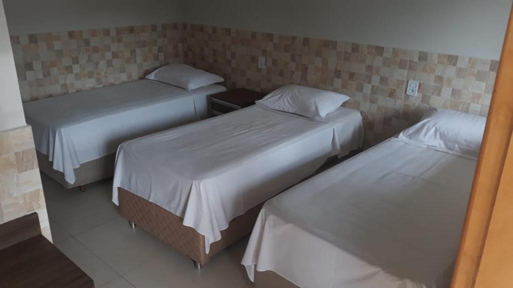 Postel nebo postele na pokoji v ubytování Hotel Maringa