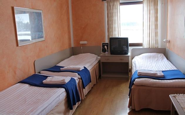 Postel nebo postele na pokoji v ubytování Yxnerum Hotell