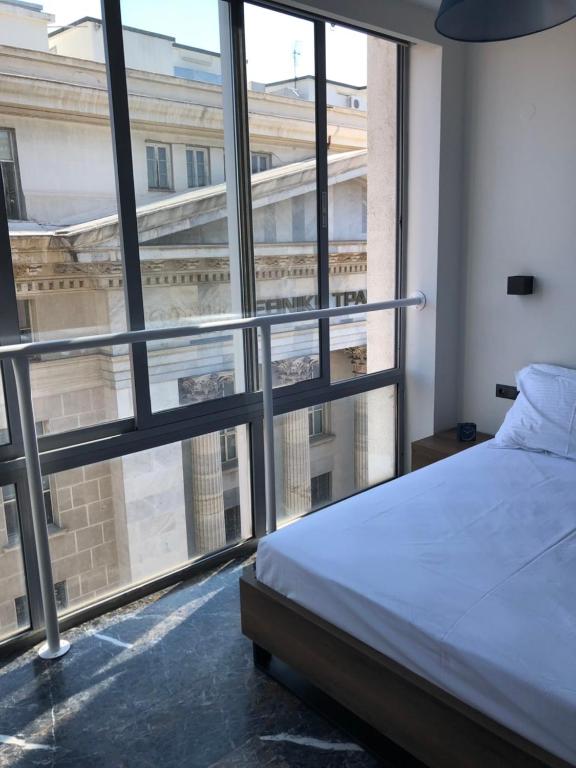 Łóżko lub łóżka w pokoju w obiekcie Ladadika 5th Floor