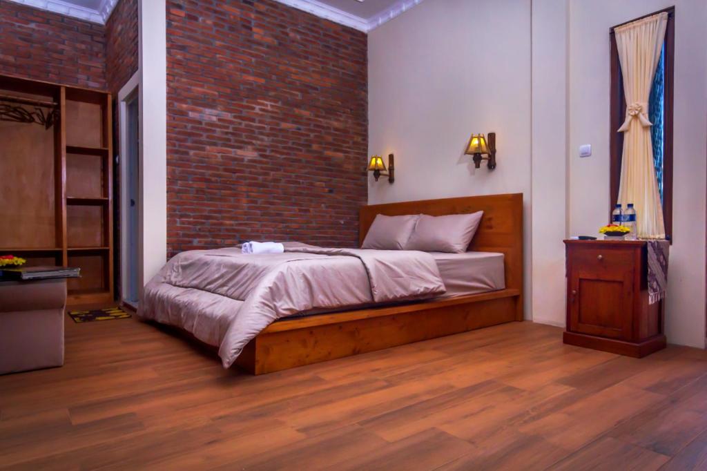 Postel nebo postele na pokoji v ubytování Maher House Borobudur