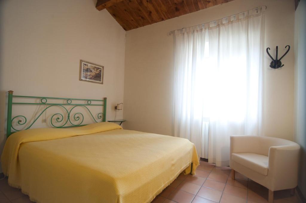 Postel nebo postele na pokoji v ubytování Valcastagno Relais & Residence