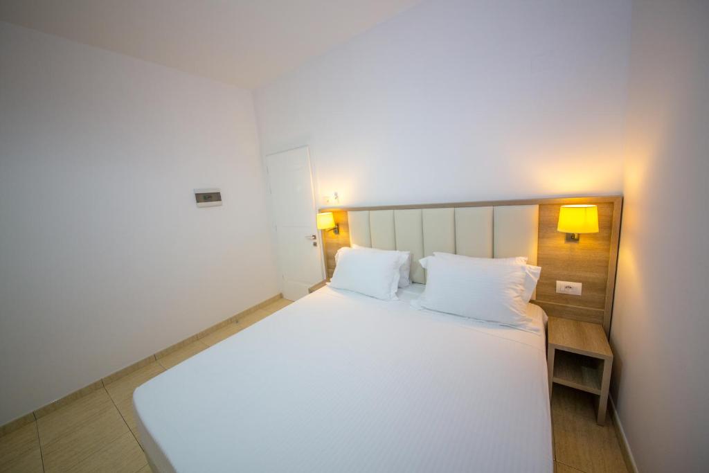 Postel nebo postele na pokoji v ubytování Hotel Alina