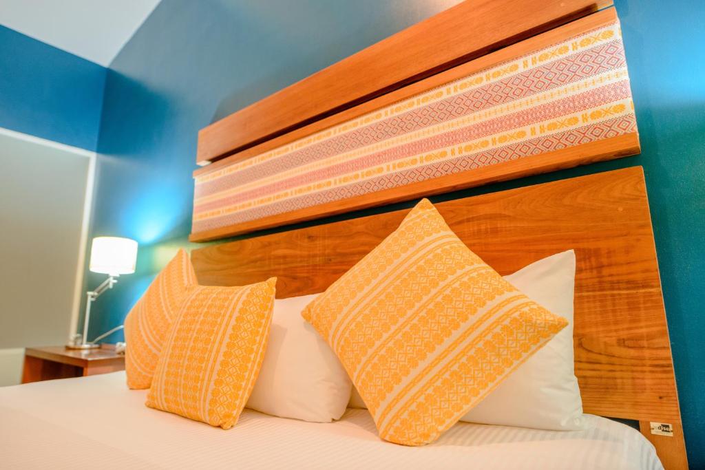 Postel nebo postele na pokoji v ubytování Hotel Loma Real