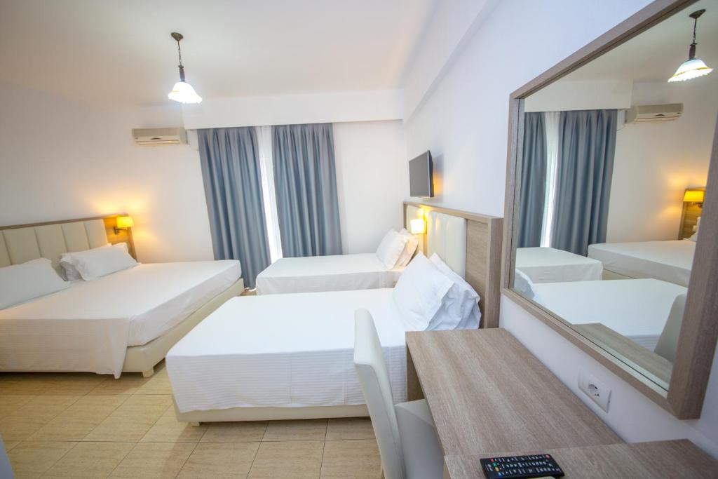 Postel nebo postele na pokoji v ubytování Hotel Alina