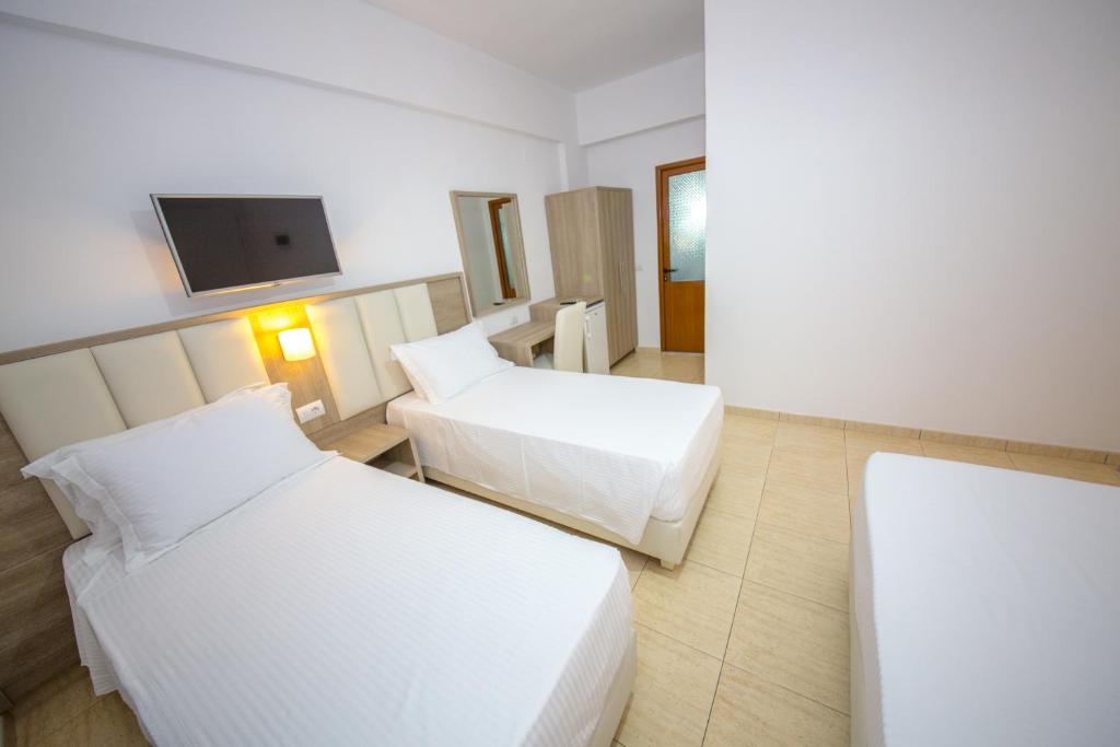 Postel nebo postele na pokoji v ubytování Hotel Alina