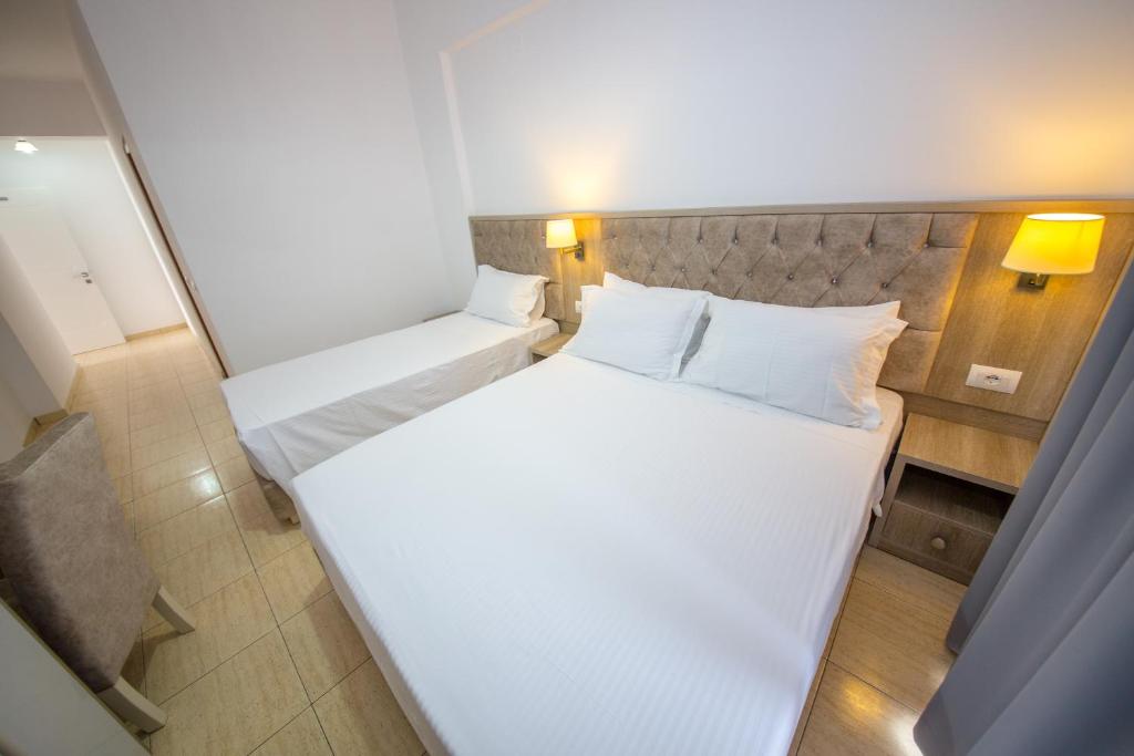 Postel nebo postele na pokoji v ubytování Hotel Alina