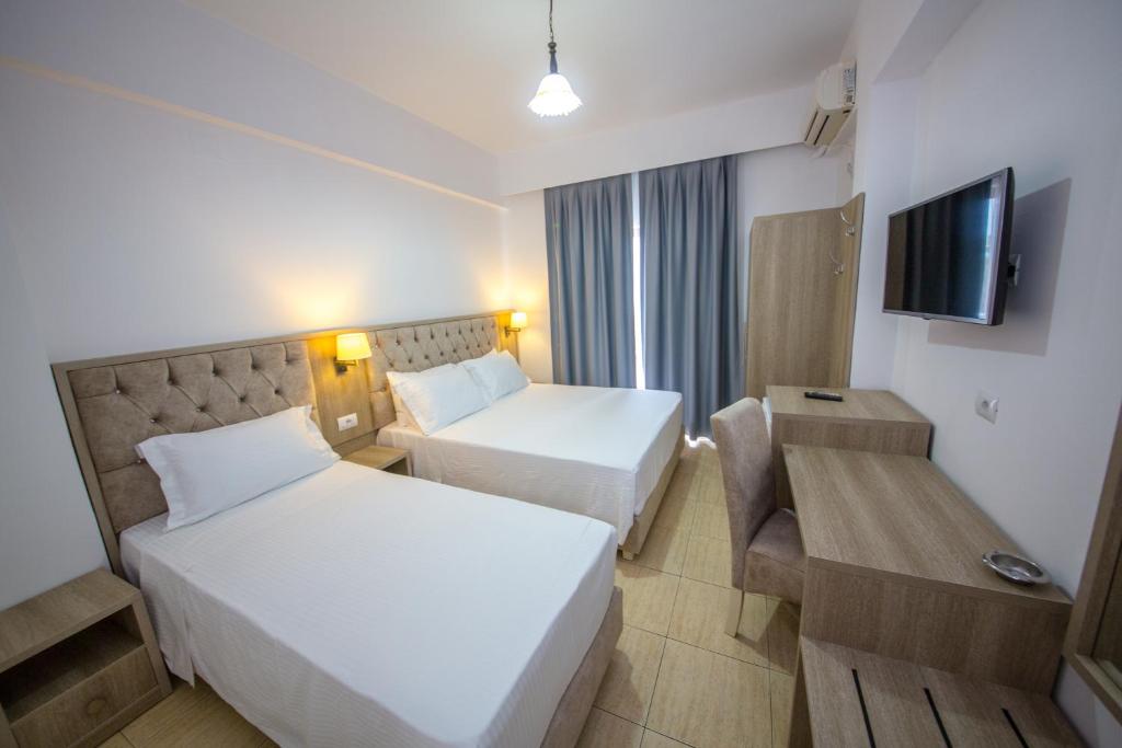 Postel nebo postele na pokoji v ubytování Hotel Alina