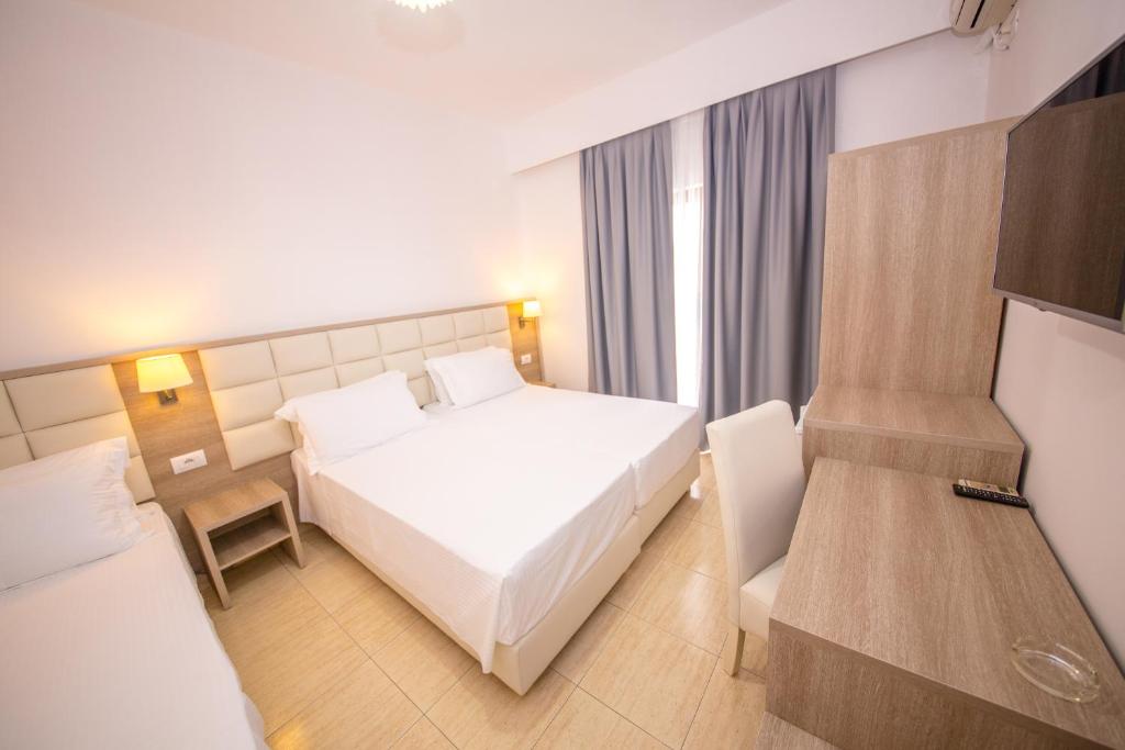 Postel nebo postele na pokoji v ubytování Hotel Alina